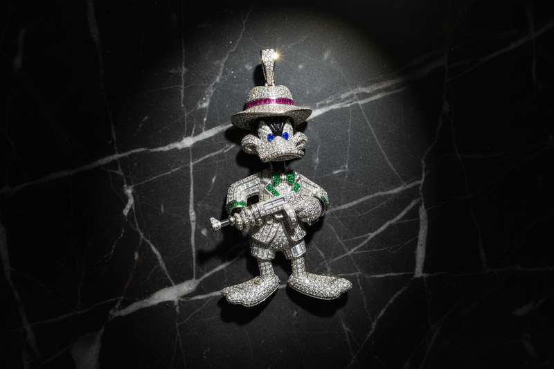 Gangster Daffy Duck diamond pendant on a black marble 
